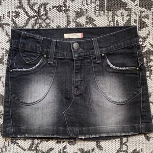 Vintage Levi’s distressed black jean mini skirt. Size 3